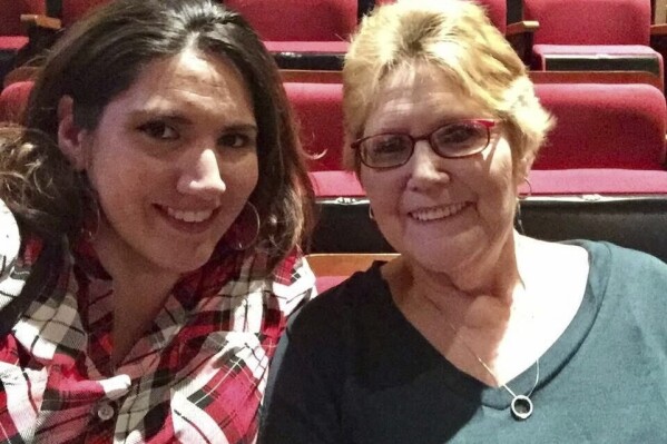 In this 2016 image provided by Misti Leon, left, she sits with her mom, Juliana Leon. Misti Leon is suing several oil and gas companies in one of the nation’s first wrongful-death claims seeking to hold the fossil fuel industry accountable for its role in the changing climate. (Misti Leon via AP)