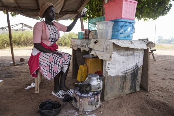 A food vendor prepares a coffee in Yambio, South Sudan Monday, Feb. 17, 2025. (AP Photo/Brian Inganga)