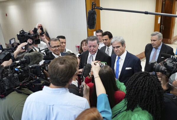 Dan Cogdell, defense attorney for suspended Texas Attorney General Ken Paxton, talks to the media after a court appearance at Harris County Courthouse on Thursday, Aug. 3, 2023 in Houston. Embattled Texas Attorney General Ken Paxton's years-delayed trial on securities fraud charges will have to wait until his separate impeachment trial is concluded, lawyers and the judge in the case said Thursday. (Elizabeth Conley/Houston Chronicle via AP)