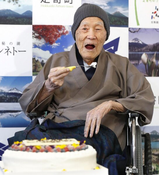 
              In this April 10, 2018, file photo, Masazo Nonaka eats a cake after receiving the certificate from Guinness World Records as the world's oldest living man at then age 112 years and 259 days during a ceremony in Ashoro on Japan's northern main island of Hokkaido. In the early hours of Sunday, Jan. 20, 2019, Nonaka died at his home _ a hot springs inn _ in northern Japan at the age of 113. (Masanori Takei/Kyodo News via AP)
            