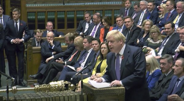 Britain's Prime Minister Boris Johnson speaks to lawmakers during the election debate in the House of Commons, London, Monday Oct. 28, 2019. The EU agreed Monday to a three month delay in Britain's Brexit departure from the bloc, and parliament will vote on Monday if to have an early General Election. (House of Commons via AP)