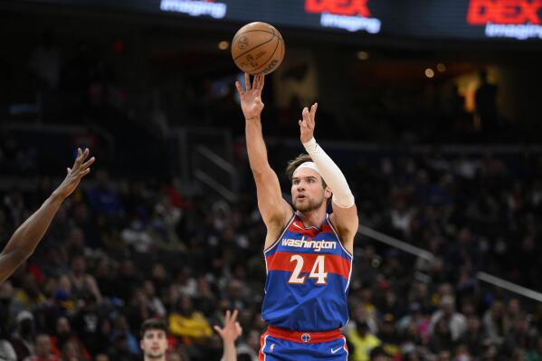 Washington Wizards forward Corey Kispert (24) shoots during the first half of an NBA basketball game against the Golden State Warriors, Sunday, March 27, 2022, in Washington. (AP Photo/Nick Wass)