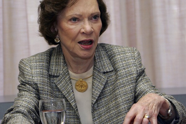 FILE - Former first lady Rosalynn Carter discusses the Institute of Medicine report, "Crossing the Quality Chasm: Adaptation to Mental Health and Addictive Disorders," during the 21st annual Rosalynn Carter Symposium on Mental Health Policy at the Carter Center, Nov. 3, 2005, in Atlanta. Health care experts say the advocacy of Carter, who died Sunday, Nov. 19, 2023, at age 96, created a framework for much of the progress on mental illness in America. (AP Photo/Ric Feld, File)
