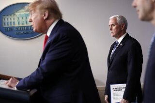 President Donald Trump speaks about the coronavirus in the James Brady Press Briefing Room of the White House, Thursday, April 9, 2020, in Washington, as Vice President Mike Pence and Labor Secretary Eugene Scalia listen. (AP Photo/Andrew Harnik)