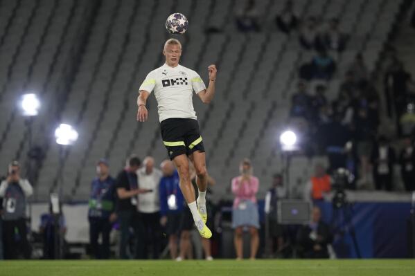 Manchester City's Erling Haaland jumps for the ball during a training session at the Ataturk Olympic Stadium in Istanbul, Turkey, Friday, June 9, 2023. Manchester City and Inter Milan are making their final preparations ahead of their clash in the Champions League final on Saturday night. (AP Photo/Antonio Calanni)