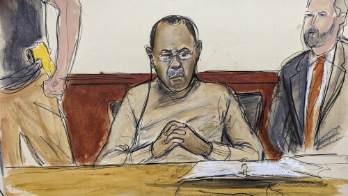 In this courtroom sketch Mozambique's former finance minister Manuel Chang, center, pleaded not guilty in a U.S. federal court, in New York, Thursday, July 13, 2023, in connection with a $2-billion corruption and money laundering scandal that prosecutors said defrauded American investors and threatened to further destabilize the economy of one of the world's poorest countries. (Elizabeth Williams via AP)