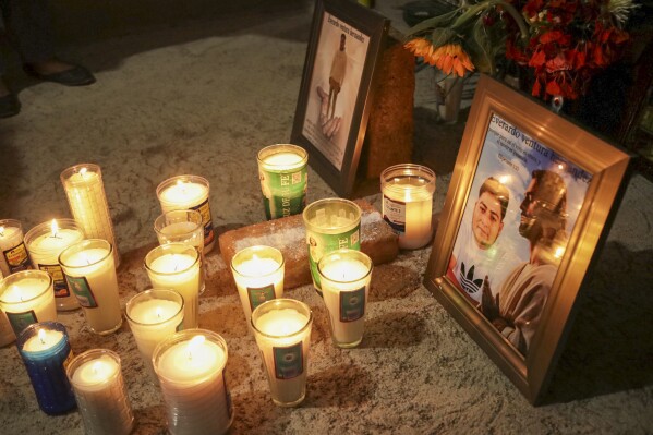 An improvised altar with photos of Evarado Ventura Hernández stands at his relatives' house in Agua Del Sol, Oaxaca, Mexico, Wednesday, May 15, 2024. Ventura Hernandez was one of eight farmworkers, all from Mexico, killed in a bus that overturned Tuesday morning in Florida. (AP Photo/Maria Alferez)