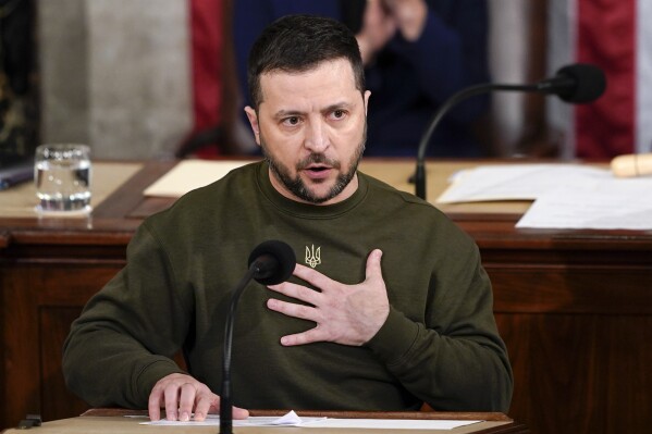 FILE - Ukrainian President Volodymyr Zelenskyy addresses a joint meeting of Congress on Capitol Hill in Washington, Dec. 21, 2022. Once rock-solid, the support that Ukraine has gotten from its biggest backers for its fight against Russia is showing cracks. (AP Photo/Carolyn Kaster, File)