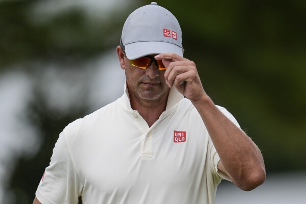 Adam Scott, of Australia, walks off the fifth green during the second round of the Tour Championship golf tournament, Friday, Aug. 30, 2024, in Atlanta. (AP Photo/Mike Stewart)