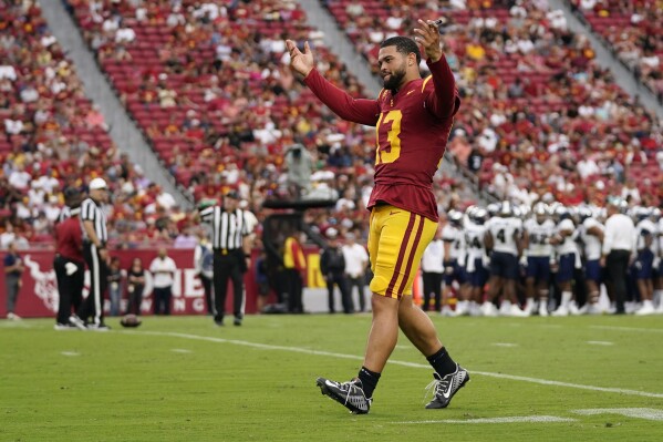 Southern California quarterback Caleb Williams (13) reacts as the crowd chants during the second half of an NCAA college football game against Nevada in Los Angeles, Saturday, Sept. 2, 2023. (AP Photo/Ashley Landis)
