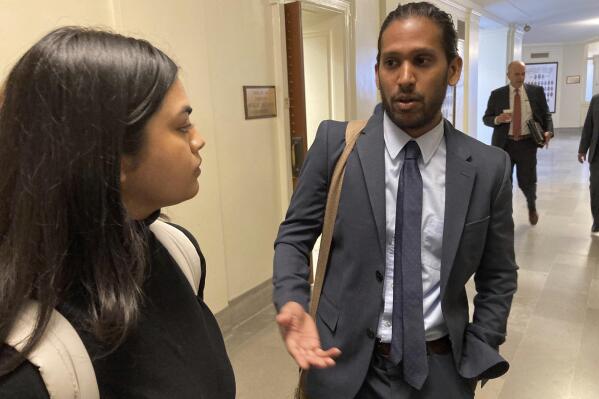 Jay Devineni, right, a student at the University of Missouri School of Medicine, talks with fellow medical school student Supriya Vuda in the hallway of the Missouri Capitol in Jefferson City, Mo., on March 28, 2023. Devineni and Vuda testified against legislation in a Senate committee that would restrict diversity, equity and inclusion initiatives in medical schools and among health care providers. (AP Photo/David A. Lieb)