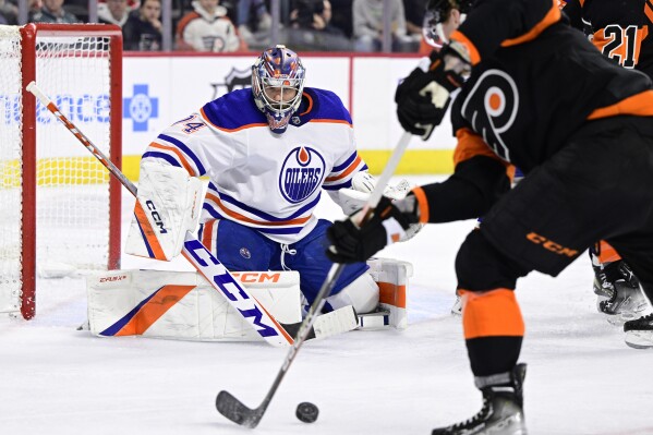 FILE - Edmonton Oilers goaltender Stuart Skinner watches the puck during the second period of the team's NHL hockey game against the Philadelphia Flyers, Thursday, Feb. 9, 2023, in Philadelphia. The Oilers exited in the second round, and a lot of fingers were pointed at Skinner, who had just an .883 save percentage in the postseason and was pulled four times (AP Photo/Derik Hamilton, File)