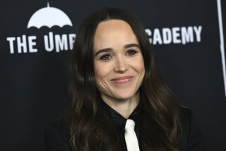 FILE - Elliot Page arrives at the Los Angeles premiere of "The Umbrella Academy" on Feb. 12, 2019. Page, the Oscar-nominated actor of “Juno”, “Inception” and “The Umbrella Academy” came out as transgender on Tuesday in an announcement greeted as a watershed moment for the trans community in Hollywood. The 33-year-old actor from Nova Scotia said his decision came after a long journey and with much support from the LGBTQ community. (Photo by Jordan Strauss/Invision/AP, File)