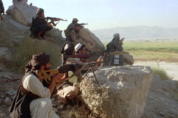Taliban militants take position at the outskirt of Laghman province of Afghanistan Friday, Sep 13, 1996. Afghan government troops retreated from eastern Afghan province of Laghman after the rebel force on Friday overran the provincial capital and captured several key districts. (AP Photo/Haider Shah)