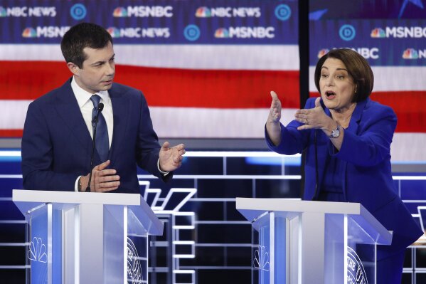 Democratic presidential candidates, Sen. Amy Klobuchar, D-Minn., right, speaks as former South Bend Mayor Pete Buttigieg looks on during a Democratic presidential primary debate Wednesday, Feb. 19, 2020, in Las Vegas, hosted by NBC News and MSNBC. (AP Photo/John Locher)