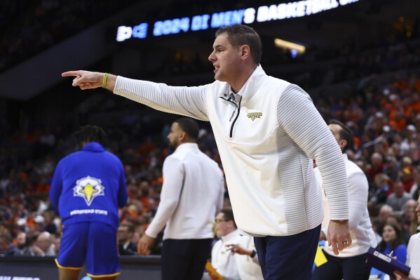 Morehead State head coach Preston Spradlin yells to his team as they played against Illinois in the first half of a first-round college basketball game in the NCAA Tournament, Thursday, March 21, 2024, in Omaha, Neb. (AP Photo/John Peterson)