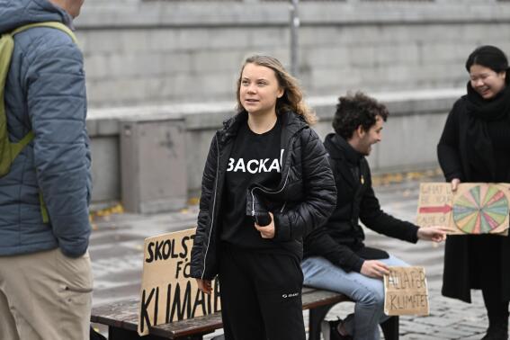 FILE - Climate activist Greta Thunberg arrives at the weekly Fridays for Future demonstration at the Mynttorget square next to the Swedish Parliament Riksdagen, in Stockholm, Sweden, on Nov. 11, 2022. Thunberg said Friday June 9, 2023 she will no longer be able to skip classes as a way to draw attention to climate change because she is graduating from high school. (Pontus Lundahl/TT News Agency via AP, File)