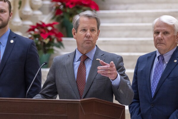 Gov. Brian Kemp speaks at a press conference at the Capitol in Atlanta on Monday, Dec. 18, 2023, announcing that he'll provide a $1,000 retention bonus to state employees, teachers and school support staff this holiday season. (Arvin Temkar/Atlanta Journal-Constitution via AP)