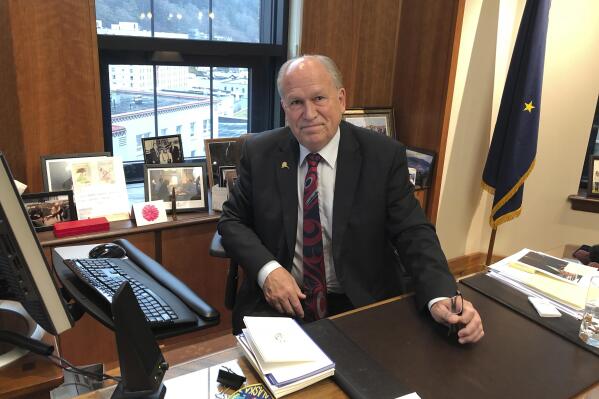 FILE - In this Nov. 13, 2018 file photo, Alaska Gov. Bill Walker poses in his office at the state Capitol in Juneau, Alaska. Walker announced plans Tuesday, Aug. 17, 2021, to run for governor again and said his former labor commissioner, Heidi Drygas, would be his running mate. (AP Photo/Becky Bohrer, File)