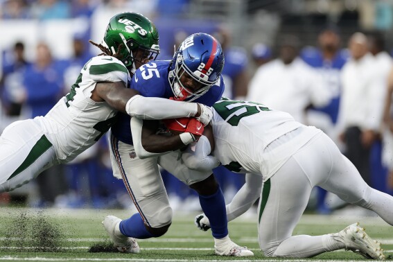 New York Giants running back Jashaun Corbin (25) runs the ball during the first half of an NFL preseason football game against the New York Jets, Saturday, Aug. 26, 2023, in East Rutherford, N.J. (AP Photo/Adam Hunger)