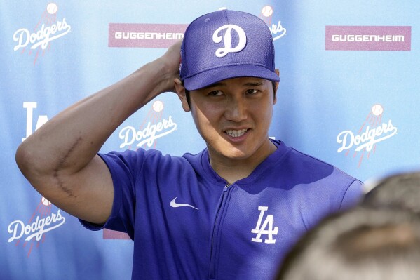 Los Angeles Dodgers' Shohei Ohtani addresses the media about his surprise marriage announcement, Thursday, Feb. 29, 2024, during spring training baseball workouts at Camelback Ranch in Phoenix. (AP Photo/Darryl Webb)