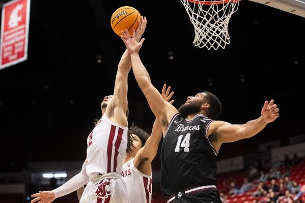 Washington State guard Tyrell Roberts (2) grabs a rebound over Santa Clara forward Keshawn Justice (14) during the second half of an NCAA college basketball game in the NIT on Tuesday, March 15, 2022, in Pullman, Wash. (Zach Wilkinson/Lewiston Tribune via AP)