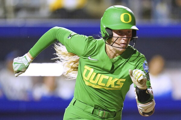 Oregon catcher Emma Cox (21) during an NCAA softball Women's College World Series game in Oklahoma City, Thursday, May 29, 2025. (AP Photo/Vera Nieuwenhuis, File)