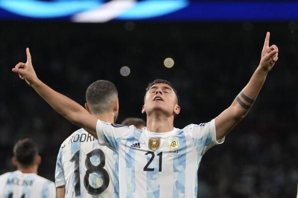 FILE - Argentina's Paulo Dybala celebrates after scoring his side's 3rd goal during the Finalissima soccer match between Italy and Argentina at Wembley Stadium in London, on June 1, 2022. José Mourinho and Conference League champion Roma are stepping up their ambitions with the signing of former Juventus forward Paulo Dybala. Three weeks after his contract expired at Juventus, the 28-year-old Argentina forward agreed to a three-year deal at Roma, the capital club announced Wednesday, July 20, 2022. (AP photo/Frank Augstein)