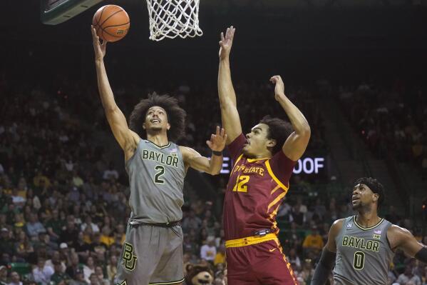 Baylor guard Kendall Brown (2) shoots against Iowa State forward Robert Jones (12) as Baylor's Flo Thamba (0) looks on during the first half of an NCAA college basketball game in Waco, Texas, Saturday, March 5, 2022. (AP Photo/LM Otero)