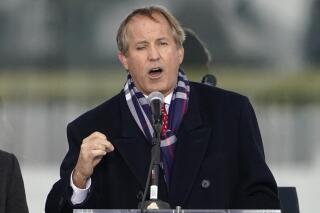 FILE - Texas Attorney General Ken Paxton speaks in Washington on Jan. 6, 2021. Paxton ran out of his house Monday, Sept. 26, 2022, and into a truck driven by his wife, a state senator, to avoid being served a subpoena in an abortion access case, according to court documents. (AP Photo/Jacquelyn Martin, File)