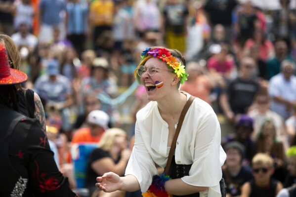 FILE - A Grand Haven Pride Fest attendee is seen cheering during a drag show at the Lynne Sherwood Waterfront Stadium in Grand Haven, Mich., on Saturday, June 10, 2023. (AP Photo/Kristen Norman, File)