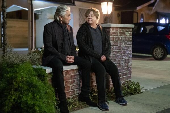 This image released by Netflix shows Michael Douglas, left, and Kathleen Turner in a scene from the third and final season of "The Kominsky Method." (Erik Voake/Netflix via AP)