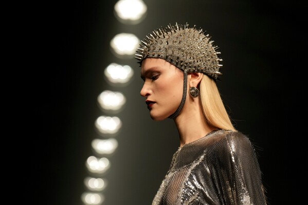 A model wears a creation as part of the Versace Fall/Winter 2025-2026 Womenswear collection presented in Milan, Italy, Friday, Feb. 28, 2025. (AP Photo/Luca Bruno, File)