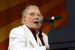 
              FILE - In this May 2, 2015 file photo, Jerry Lee Lewis performs at the New Orleans Jazz & Heritage Festival in New Orleans. Rock ’n’ roll pioneer Lewis is recovering after a minor stroke, but he’s expected to make a full recovery. A statement from his publicist says the 83-year-old Rock & Roll Hall of Famer had the stroke Thursday night, Feb. 28, 2019, and is recuperating in Memphis.  (Photo by John Davisson/Invision/AP, File)
            
