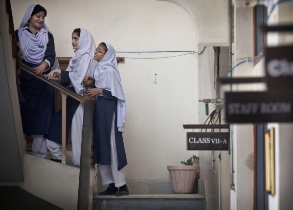 FILE - Pakistani children get ready for class at Malala Yousufzai's old school in Mingora, Swat Valley, Pakistan, Oct. 5, 2013. (AP Photo/Anja Niedringhaus, File)
