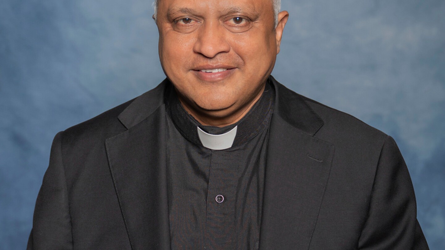 A man is in custody after the fatal shooting of a beloved Kansas priest