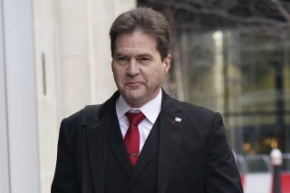 FILE - Craig Wright arrives at the Rolls Building in London for a hearing over the identity of the creator of Bitcoin, in London, Feb. 23, 2024. Wright, an Australian computer scientist found to have falsely claimed to be the mysterious creator of the bitcoin cryptocurrency, will be referred to British prosecutors for possible perjury and forgery charges, a London judge said Tuesday, July 16, 2024. (Lucy North/PA via AP)