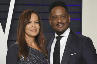 FILE - Desiree DaCosta, left, and Blair Underwood arrive at the Vanity Fair Oscar Party in Beverly Hills, salif., in this Sunday, Feb. 24, 2019, file photo. Actor Blair Underwood and his wife, Desiree DaCosta, have announced they're ending their marriage after 27 years. In a joint statement posted to Instagram, the couple called their marriage “a beautiful journey" and praised their three children, ages 24, 22 and 19.  (Photo by Evan Agostini/Invision/AP, File)