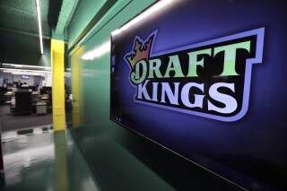 FILE - The DraftKings logo is displayed at the sports betting company headquarters, May 2, 2019, in Boston. DraftKings apologized Monday, Sept. 11, 2023, after using the Sept. 11, 2001, terror attacks to entice people to bet on baseball and football games on the anniversary of the tragedy that killed nearly 3,000 people. (AP Photo/Charles Krupa, File)