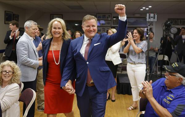 State Attorney General candidate Gentner Drummond enters his watch party to declare victory at the VFW Tuesday, June 28, 2022 in Tulsa, Okla. Drummond has knocked off incumbent Attorney General John O’Connor in the Republican primary in the race for Oklahoma attorney general. (Mike Simons/Tulsa World via AP)