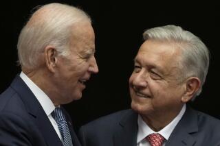 FILE - Mexican President Andres Manuel Lopez Obrador, right, and U.S. President Joe Biden shake hands at the National Palace in Mexico City, Jan. 9, 2023. Mexico’s president said on May 8, 2023 that he will talk with Biden by telephone on May 9 about immigration and the fentanyl crisis. (AP Photo/Fernando Llano, File)