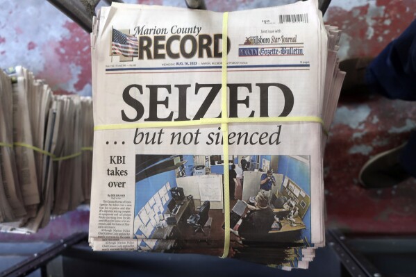 FILE - A stack of the Marion County Record sits in the back of the newspaper's building, awaiting unbundling, sorting and distribution, Aug. 16, 2023, in Marion, Kan. The police chief who led a highly criticized raid of the small Kansas newspaper is suspended, the mayor confirmed to The Associated Press on Saturday, Sept. 30. Marion Mayor Dave Mayfield in a text said he suspended Chief Gideon Cody on Thursday, Sept. 28. (AP Photo/John Hanna, File)