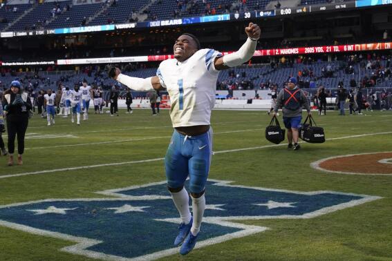 Detroit Lions cornerback Jeff Okudah (1) celebrates after beating the Chicago Bears 31-30 in an NFL football game in Chicago, Sunday, Nov. 13, 2022. (AP Photo/Charles Rex Arbogast)