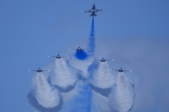South Korean Air Force's Black Eagles aerobatic team performs during the first day of the Singapore Airshow in Singapore, Tuesday, Feb. 20, 2024. (AP Photo/Vincent Thian)