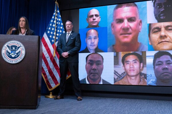 Deputy director of U.S. Immigration and Customs Enforcement Madison Sheahan, flanked by Acting director of U.S. Immigration and Customs Enforcement (ICE) Todd Lyons, speaks during a news conference at ICE Headquarters, in Washington, Wednesday, May 21, 2025. (AP Photo/Jose Luis Magana)