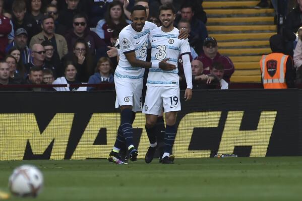 Chelsea's Mason Mount, right, celebrates with teammate Pierre-Emerick Aubameyang after scoring his side's first goal during the English Premier League soccer match between Aston Villa and Chelsea at Villa Park in Birmingham, England, Sunday, Oct. 16, 2022. (AP Photo/Rui Vieira)