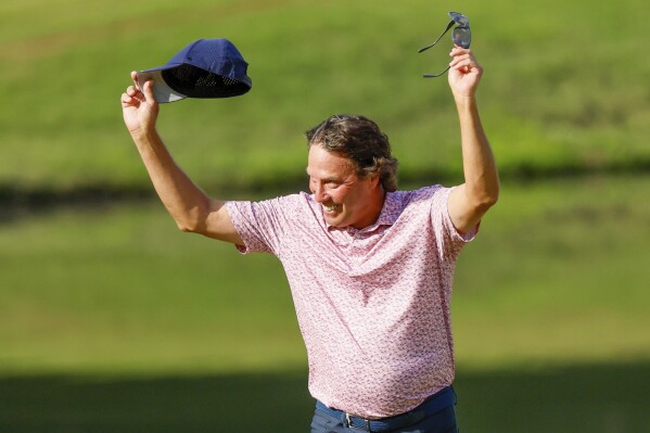 Stephen Ames reacts after making his putt on the 18th green on the 18th hole during the final round of the Mitsubishi Classic senior golf tournament at TPC Sugarloaf, Sunday, April 28, 2024, in Duluth, Ga. (Miguel Martinez/Atlanta Journal-Constitution via AP)