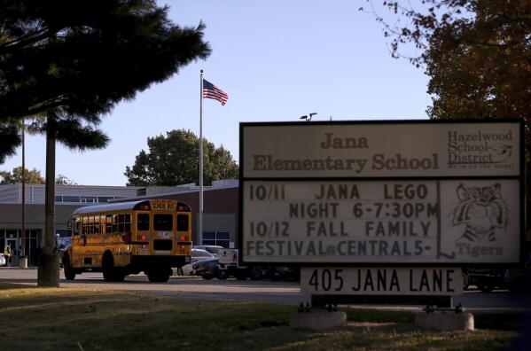 A school bus arrives at Jana Elementary School on Monday, Oct. 17, 2022 in Florissant, Mo. Radioactive samples were found at the Hazelwood School District school, according to a recently released report. Nearby Coldwater Creek, which flooded in August, was contaminated by waste from nuclear bombs manufactured during World War II. (Christian Gooden/St. Louis Post-Dispatch via AP)