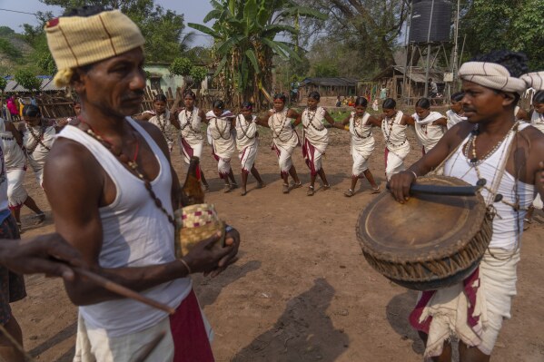 Members of the Durua tribe, part of India's Indigenous Adivasis communities, perform traditional dances during the Chaitra Parab festival, a month long harvest celebration in Hatipakna village, Koraput district, in India's eastern state of Odisha, Thursday, April 17, 2025. (AP Photo/Rafiq Maqbool)