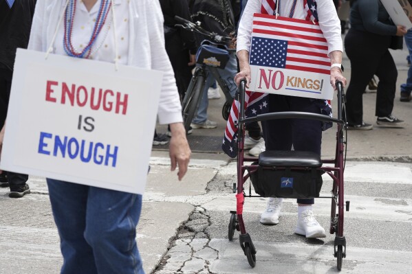 Demonstrators take part in the "No Kings Day" protest, Saturday, June 14, 2025, in Chicago. (AP Photo/Nam Y. Huh)